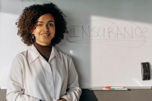 a woman and a white board
